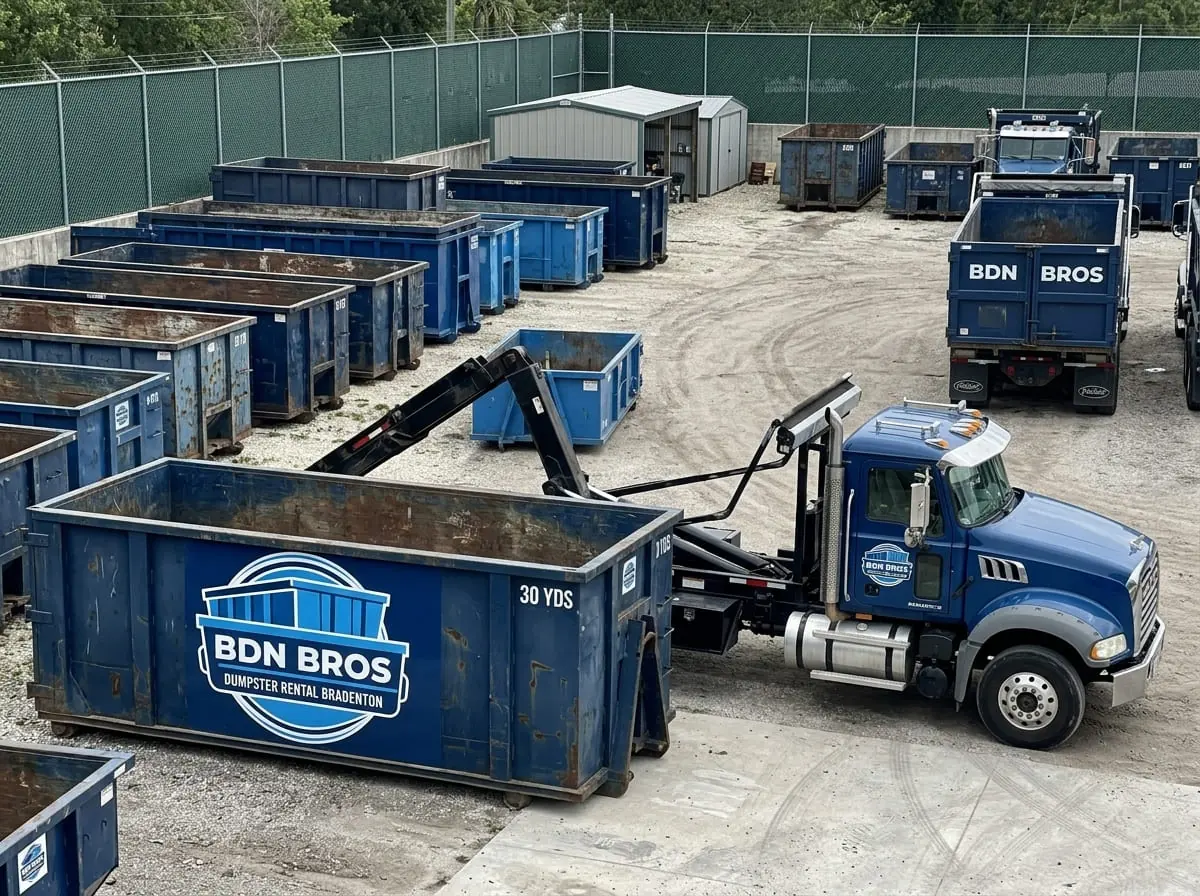 BDN Bros Dumpster Rental Bradenton trucks and roll-off dumpsters staged in the company yard serving Bradenton, FL